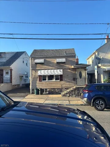 a view of living room with furniture and a fireplace