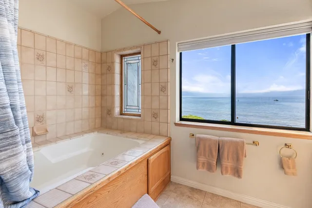 a bathroom with a bathtub and a shower