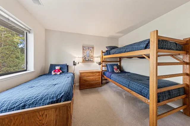 a bedroom with furniture and a window
