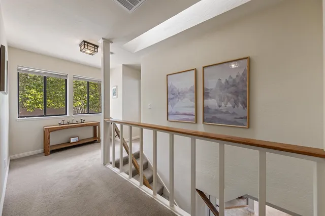 a view of a hallway with windows