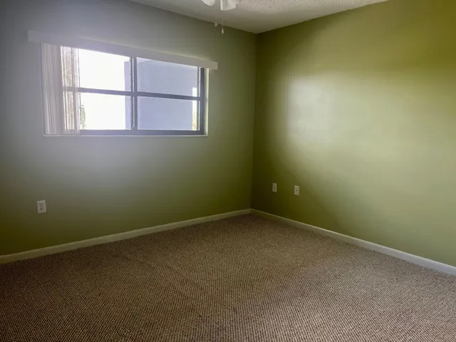 a view of a room with a fan and a fan