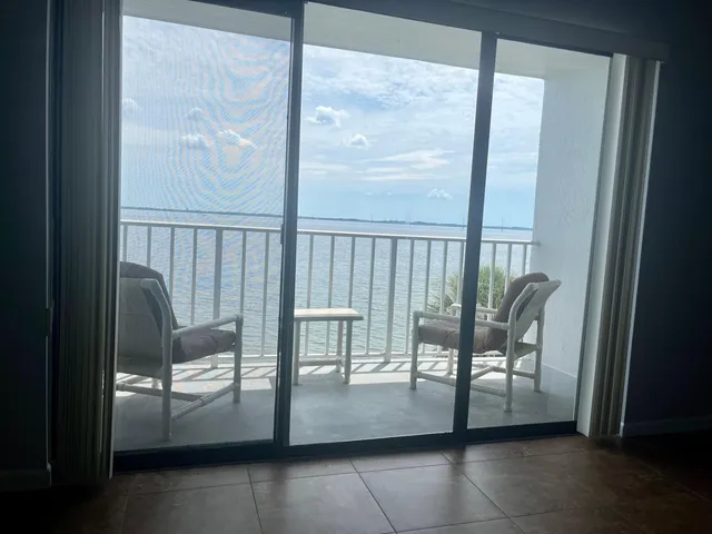 a view of a balcony with chairs