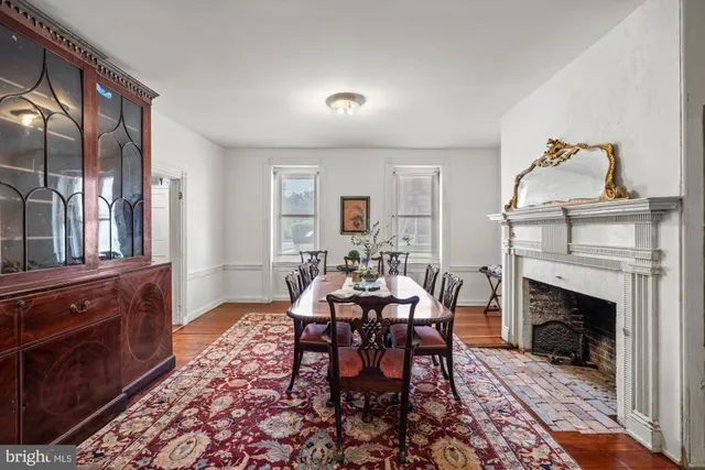 a view of a livingroom with furniture and fireplace