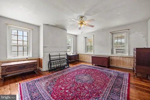 a living room with furniture rug and window