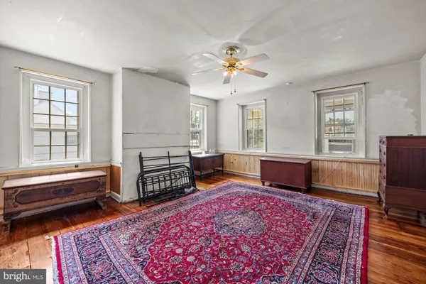a living room with furniture rug and window