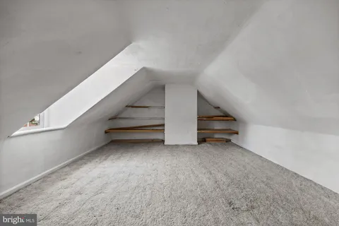 a view of an empty room with stairs