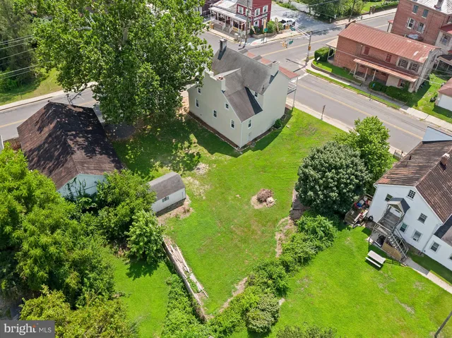 an aerial view of a house with a garden