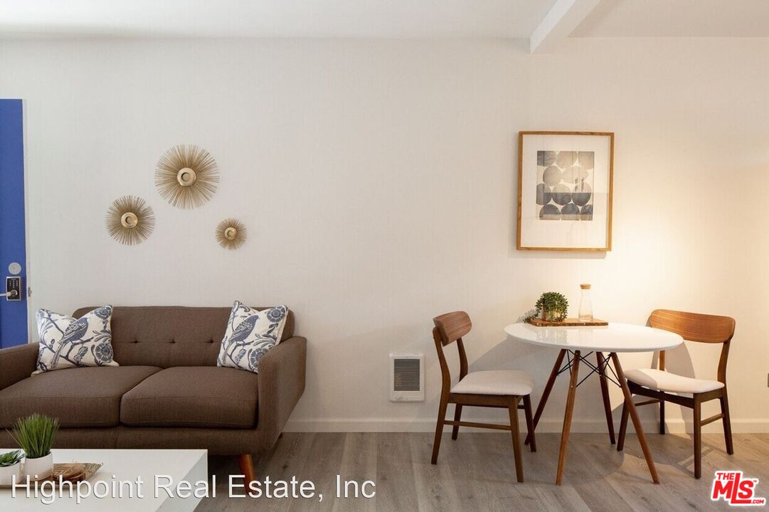 5525 Harold Way Los Angeles, CA 90028 - Photo 11 of 13 a living room with furniture and a couch