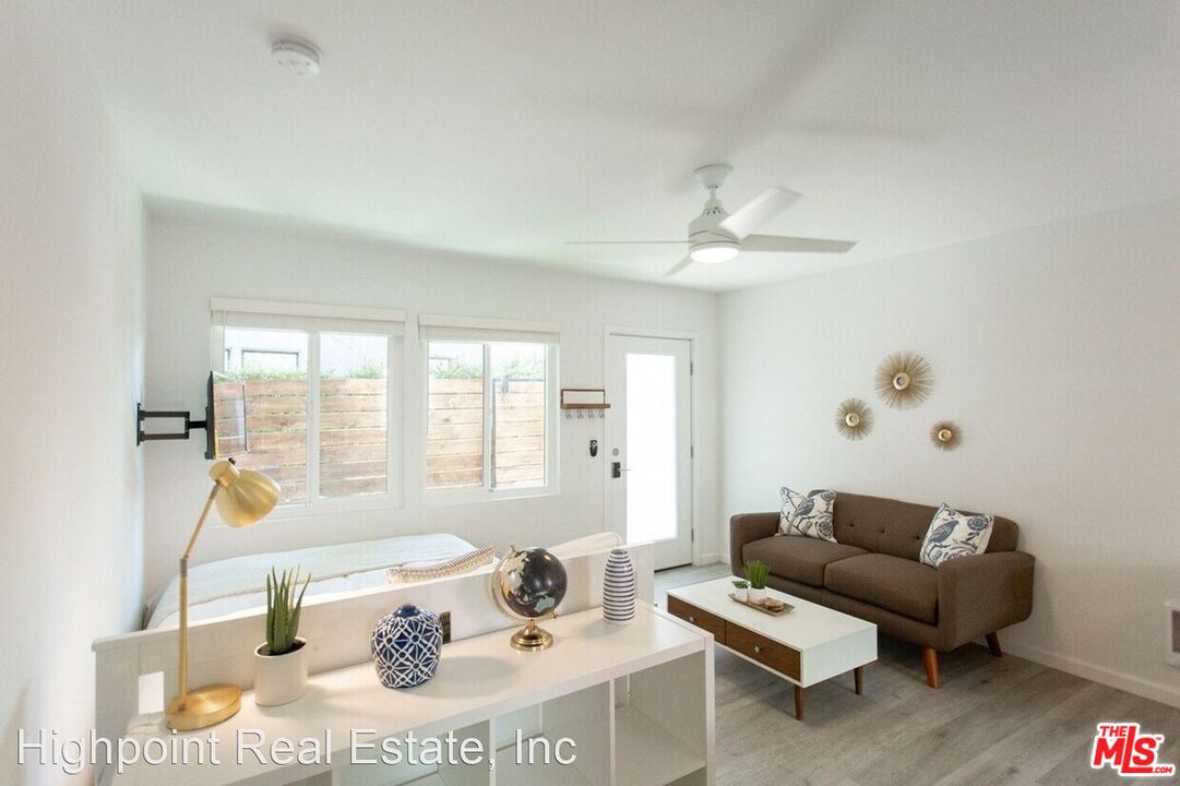 5525 Harold Way Los Angeles, CA 90028 - Photo 12 of 13 a living room with furniture and a large window