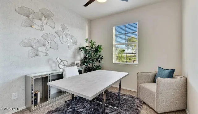 a living room with furniture and window