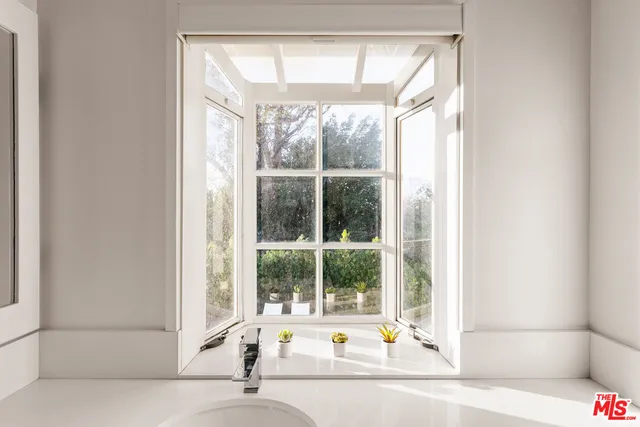 a bath tub sitting next to a window