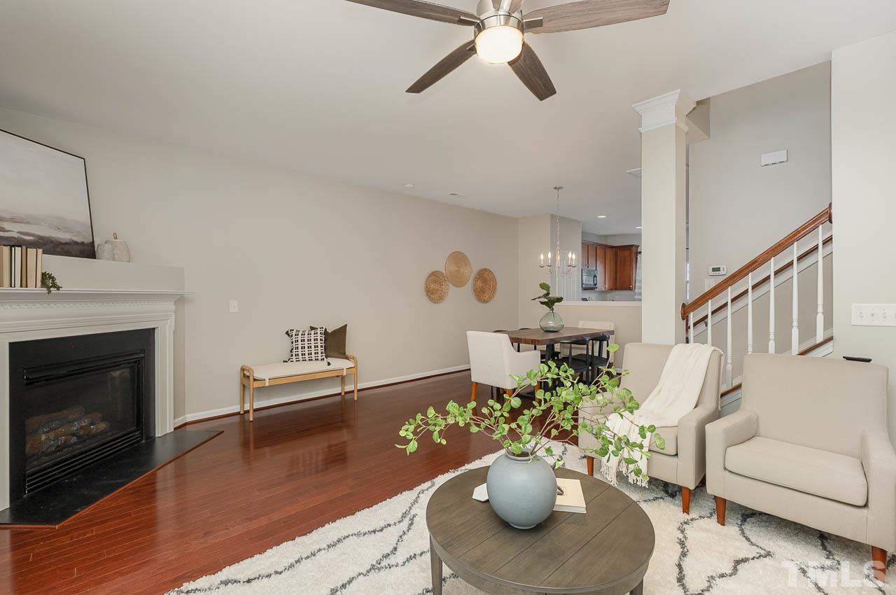 1658 Snow Mass Way Durham, NC 27713 - Photo 15 of 26 a living room with furniture potted plant and a fireplace