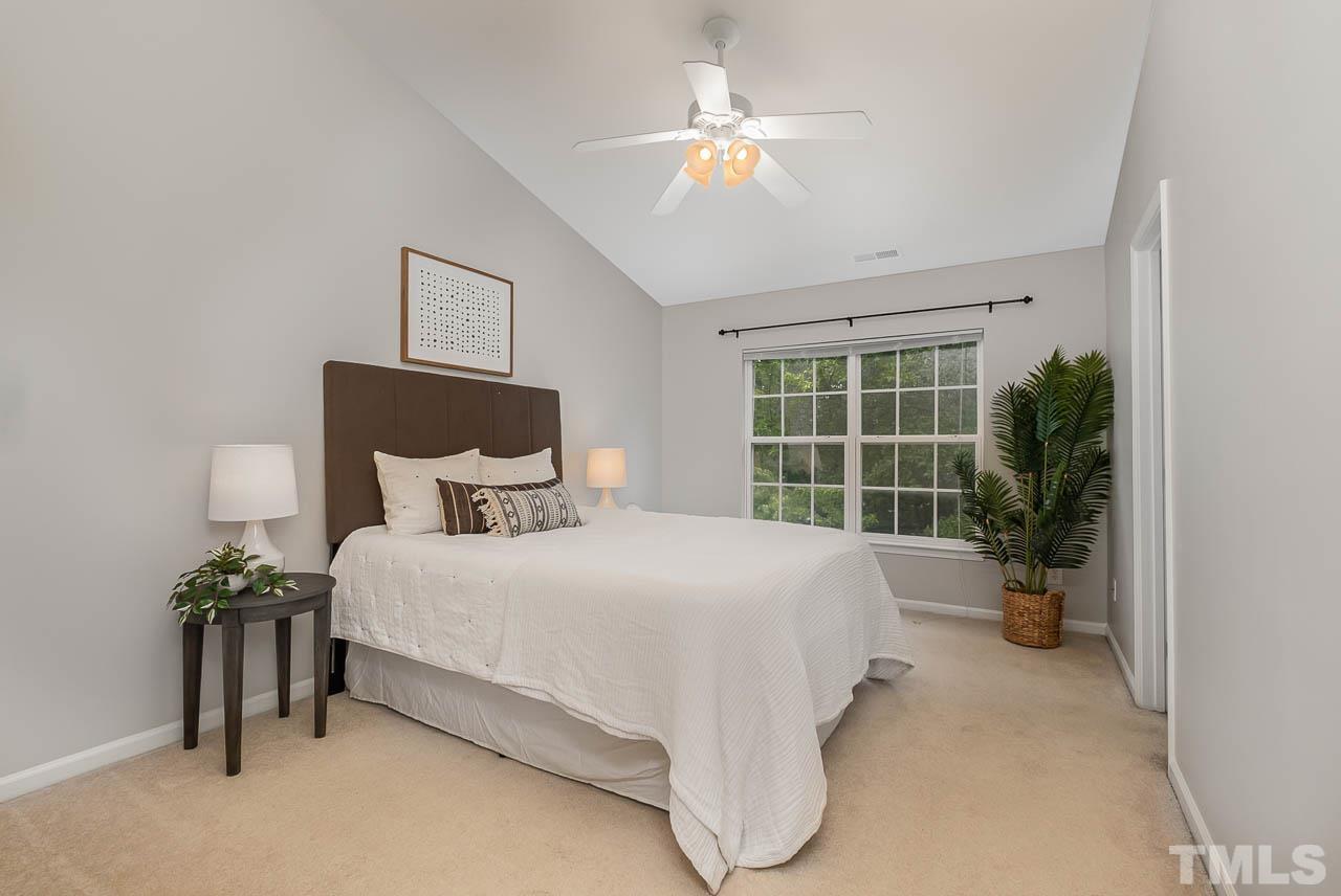 1658 Snow Mass Way Durham, NC 27713 - Photo 17 of 26 a spacious bedroom with a bed and a window