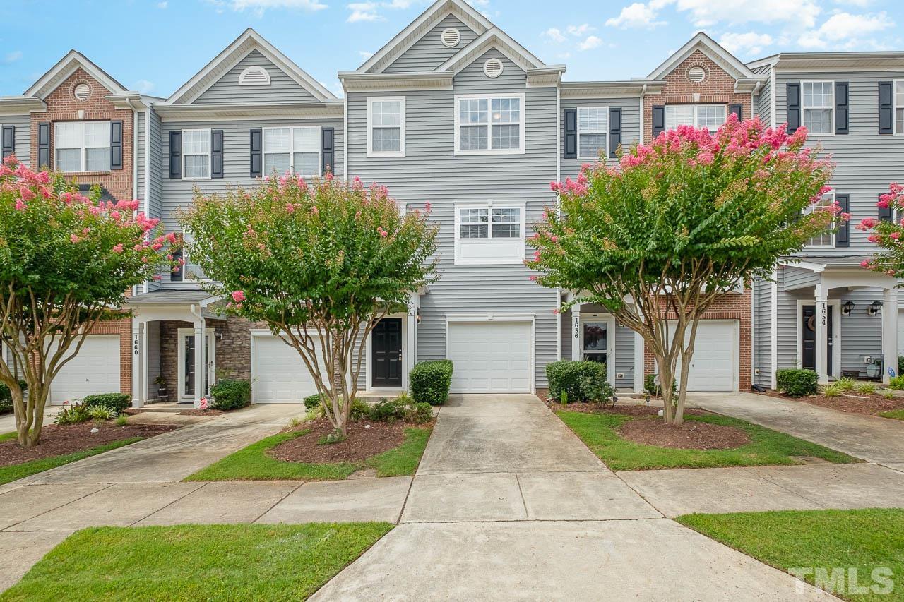 1658 Snow Mass Way Durham, NC 27713 - Photo 2 of 26 a front view of a house with garden