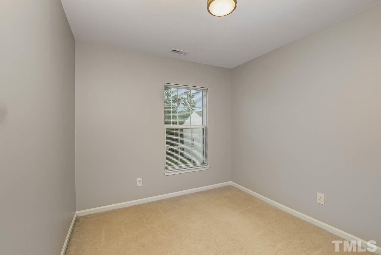 1658 Snow Mass Way Durham, NC 27713 - Photo 21 of 26 a view of an empty room with a window
