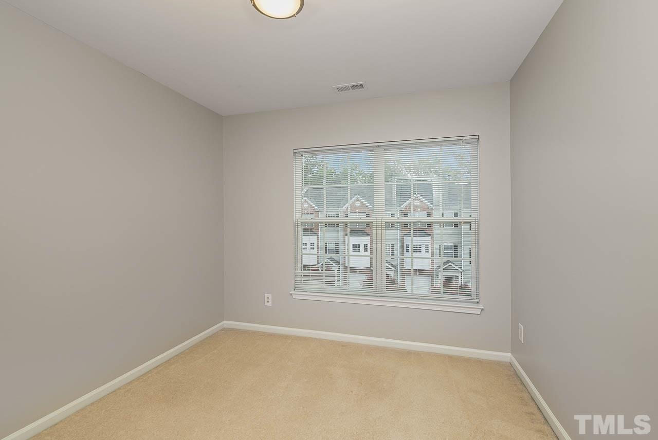 1658 Snow Mass Way Durham, NC 27713 - Photo 22 of 26 an empty room with windows