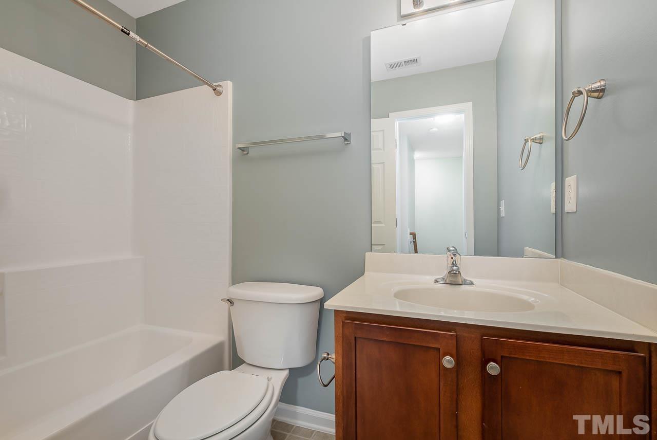 1658 Snow Mass Way Durham, NC 27713 - Photo 23 of 26 a bathroom with a sink toilet and shower
