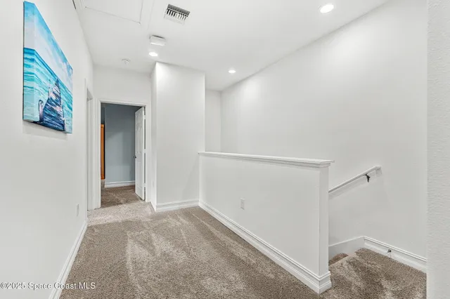 a en suite bathroom with a tub shower and a sink