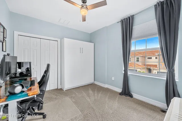 a white bath tub sitting next to a shower