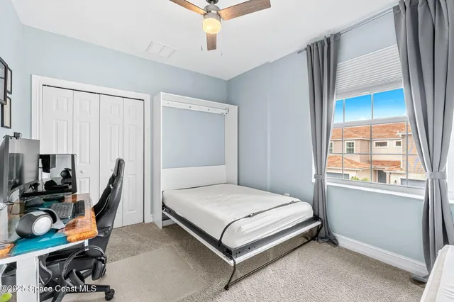 a view of a hallway with washer and dryer
