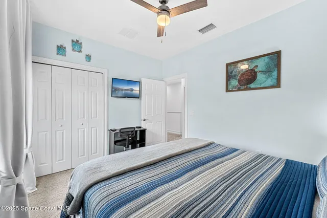 aerial view of a house with outdoor space and lake view in back