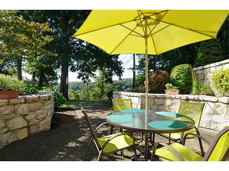 131 Thompson Hill Road Aliquippa, PA 15001 - Photo 22 of 25 Patio/Deck. The lower level exposed aggregate patio includes a stone wall and beautiful landscaping.