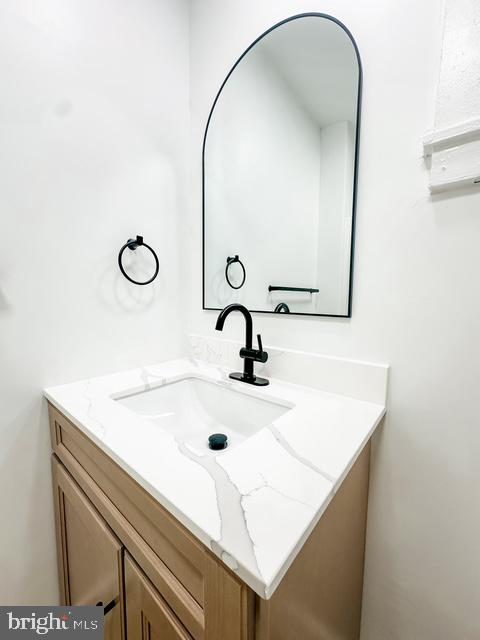 343 South Prince Street, Unit 2 Lancaster, PA 17603 - Photo 13 of 18 a bathroom with a sink and a mirror
