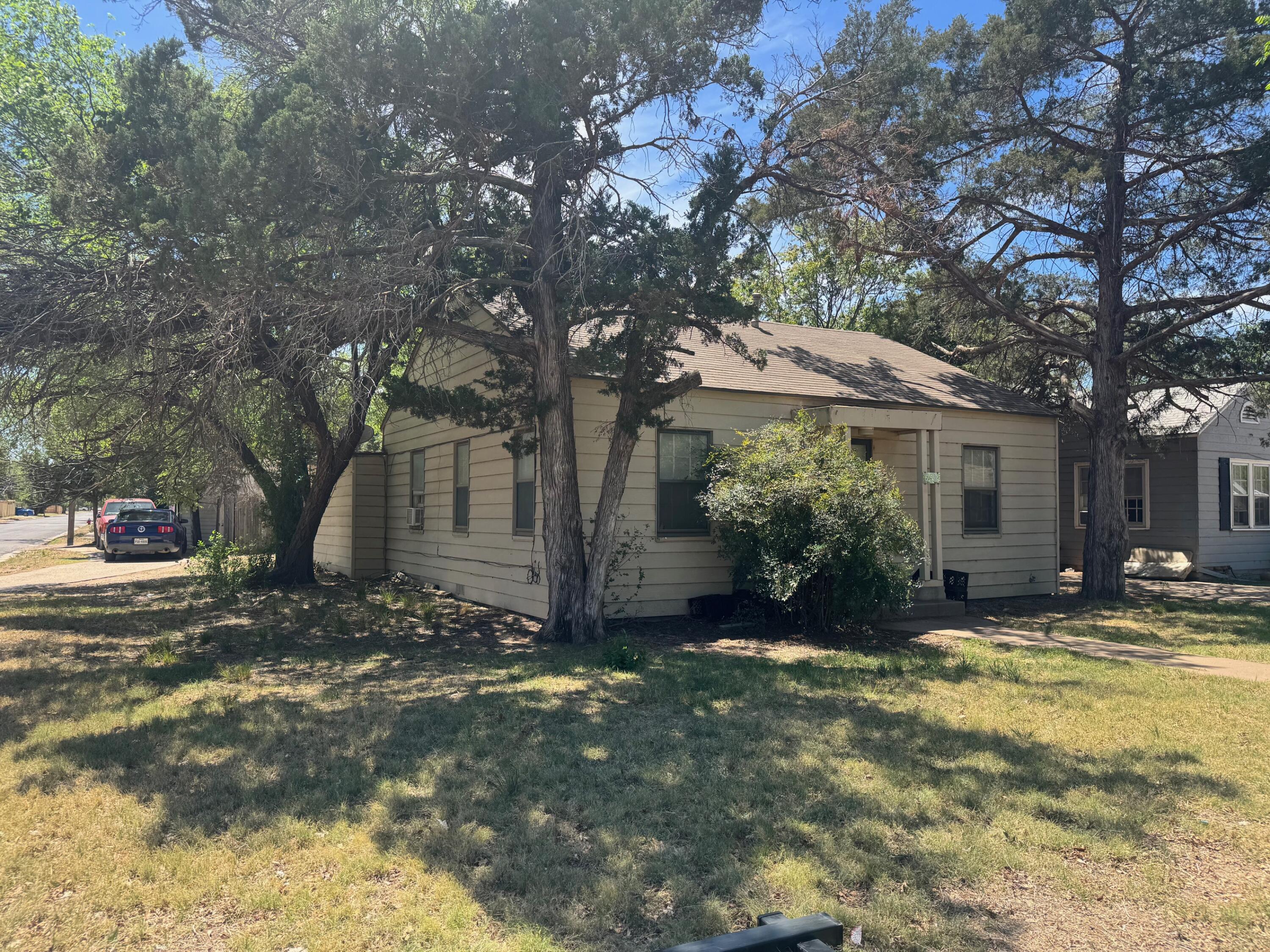 2201 25th Street Lubbock, TX 79411 - Photo 2 of 3 a view of a house with a tree in front of it