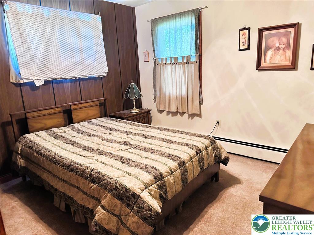 127 South 7th Street Coplay, PA 18037 - Photo 12 of 21 a bed sitting in a bedroom next to a window