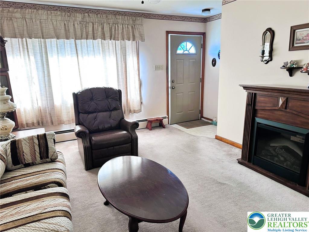 127 South 7th Street Coplay, PA 18037 - Photo 10 of 21 a living room with furniture and a fireplace