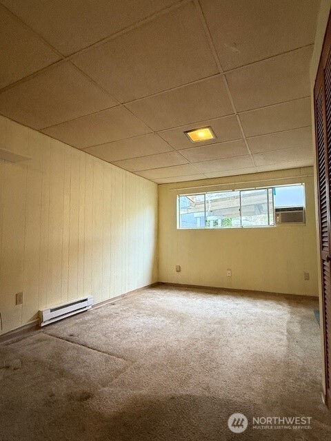 12018 Sand Point Way Northeast Seattle, WA 98125 - Photo 11 of 14 a view of an empty room with a window