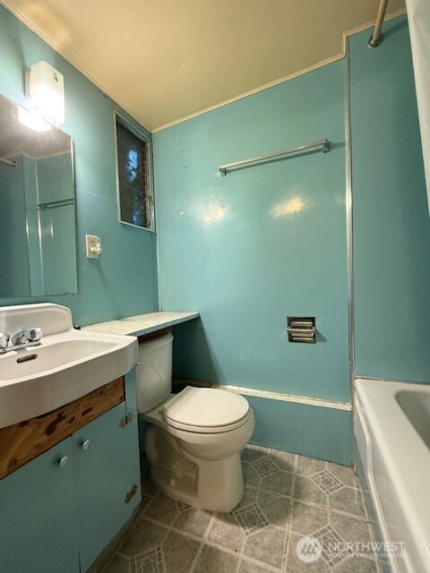 12018 Sand Point Way Northeast Seattle, WA 98125 - Photo 13 of 14 a bathroom with a sink a toilet and mirror