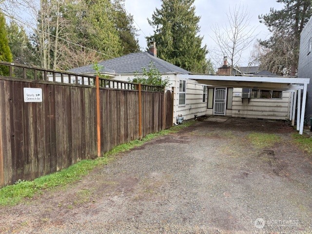 12018 Sand Point Way Northeast Seattle, WA 98125 - Photo 14 of 14 a front view of a house with a garden