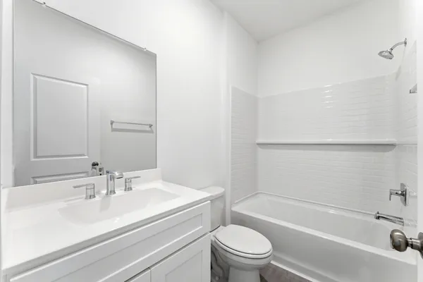 a bathroom with a sink a toilet and a bathtub