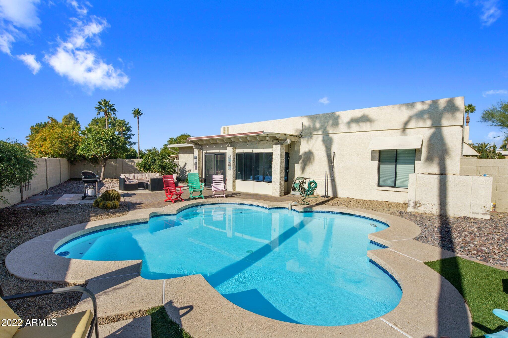 6609 East Phelps Road Scottsdale, AZ 85254 - Photo 40 of 83 a view of a house with swimming pool