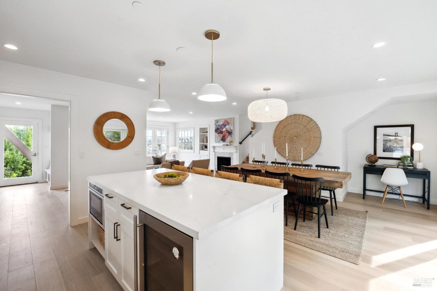 144 Richardson Drive Mill Valley, CA 94941 - Photo 11 of 43 a kitchen with a sink a stove and chairs with wooden floor