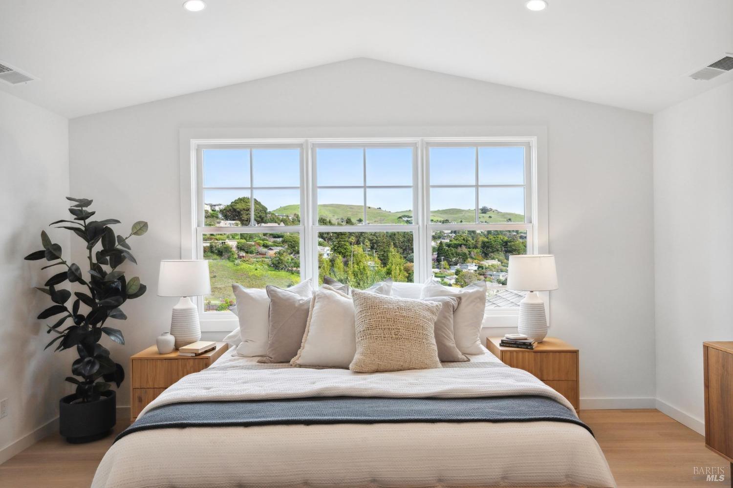 144 Richardson Drive Mill Valley, CA 94941 - Photo 14 of 43 a bed sitting in a bedroom next to a window