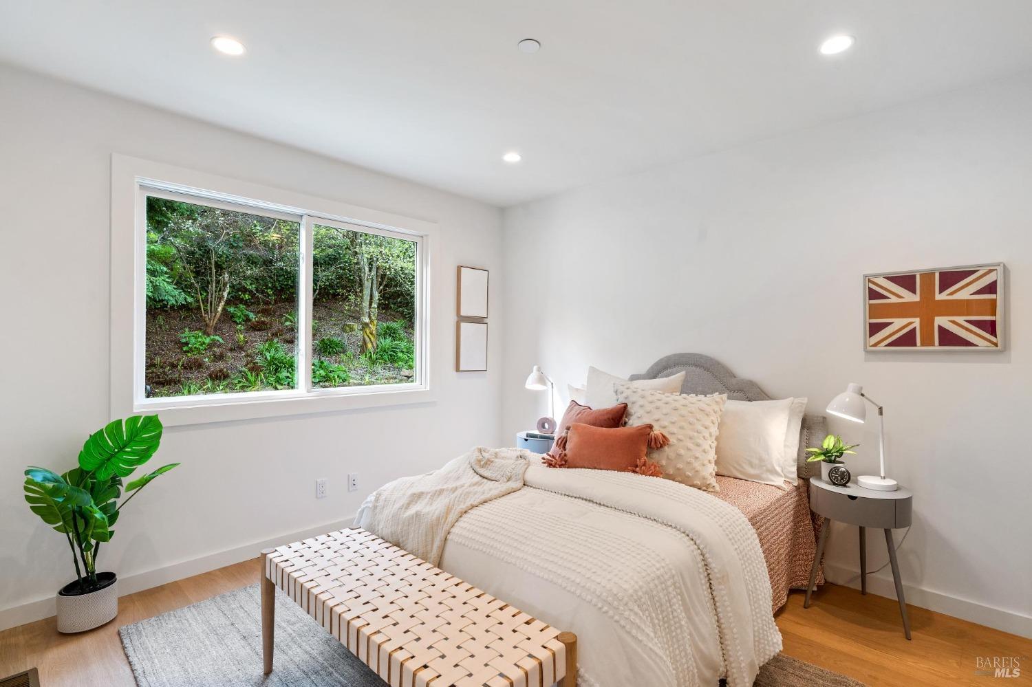 144 Richardson Drive Mill Valley, CA 94941 - Photo 25 of 43 a bedroom with a bed and a chair