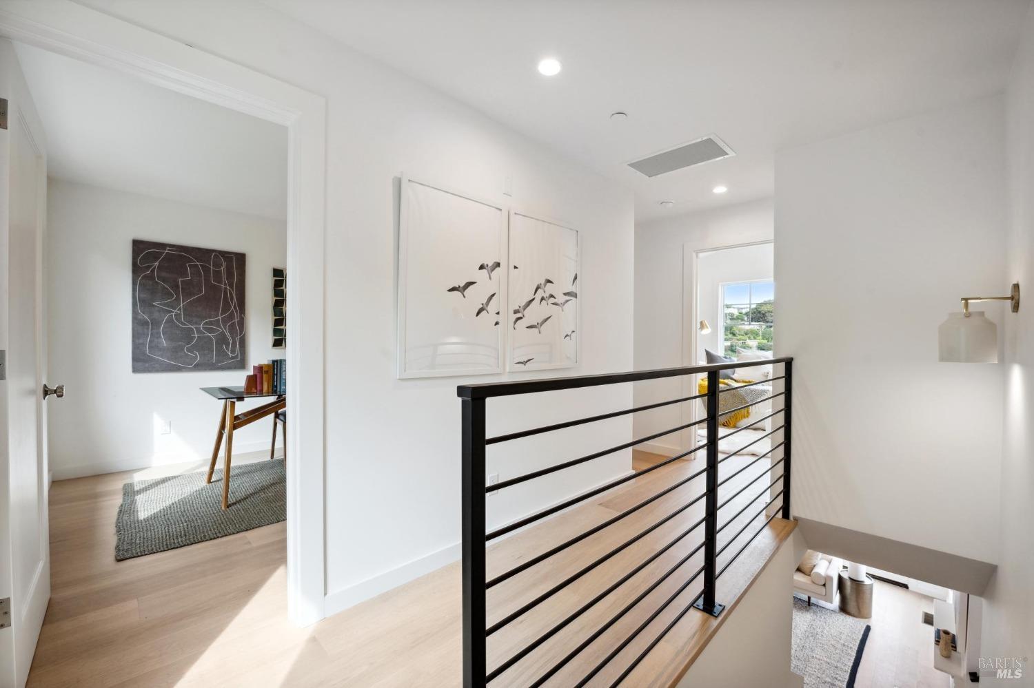 144 Richardson Drive Mill Valley, CA 94941 - Photo 28 of 43 a view of a hallway with paintings on the wall