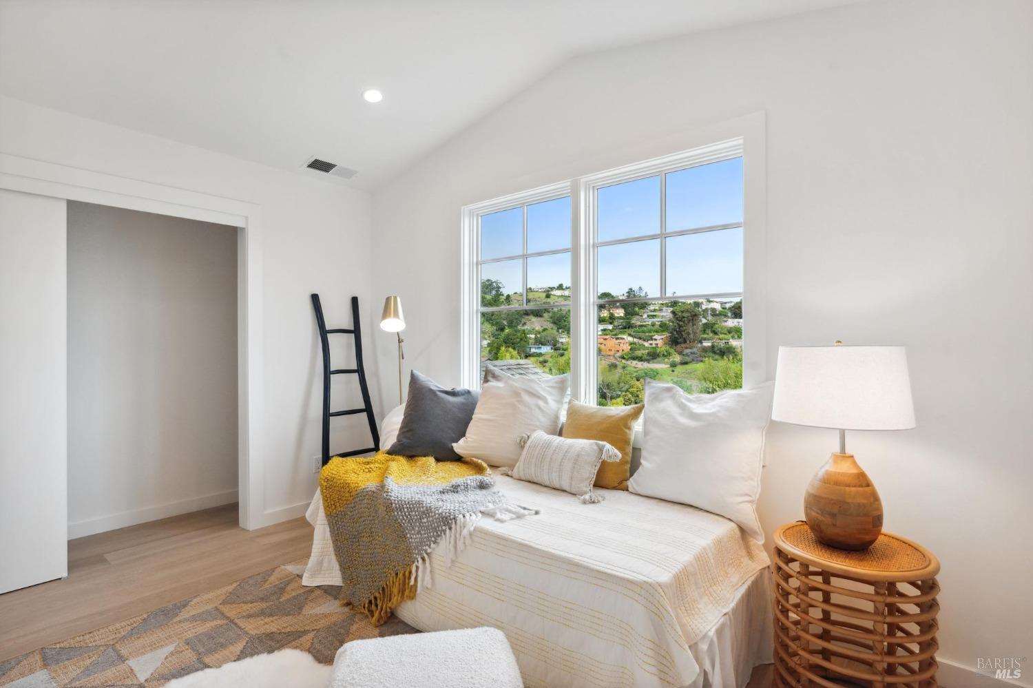 144 Richardson Drive Mill Valley, CA 94941 - Photo 31 of 43 a bedroom with a bed and wooden floor