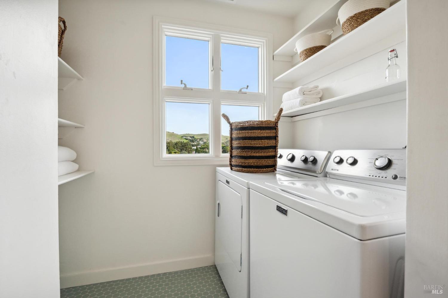 144 Richardson Drive Mill Valley, CA 94941 - Photo 33 of 43 a view of washer and dryer with kitchen in the background