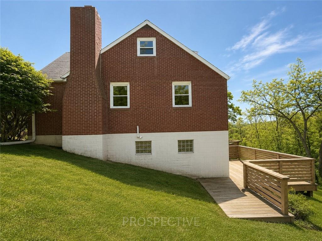 3079 Mt Troy Road Pittsburgh, PA 15212 - Photo 26 of 30 a view of a house with backyard and a tree