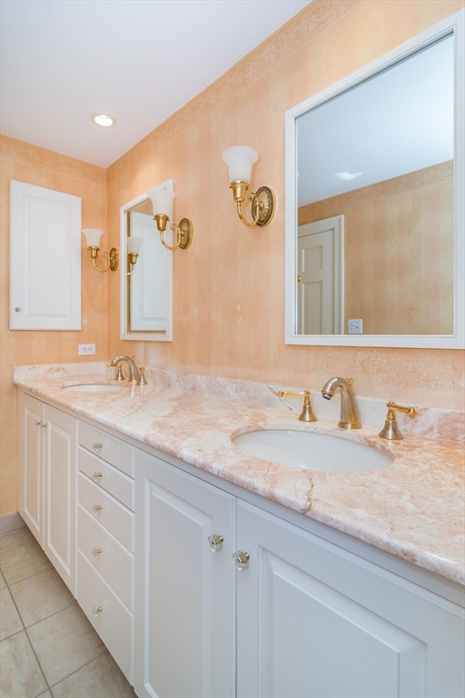 25 Edgewater Drive Needham, MA 02492 - Photo 12 of 25 a bathroom with a granite countertop sink and a mirror