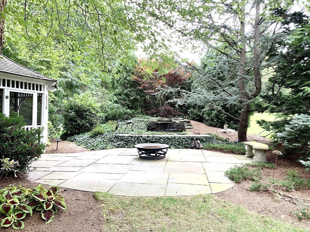 25 Edgewater Drive Needham, MA 02492 - Photo 19 of 25 a view of a yard with car parked