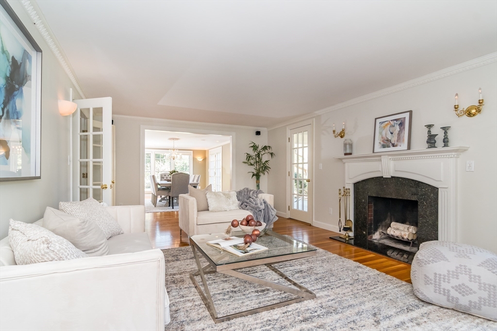 25 Edgewater Drive Needham, MA 02492 - Photo 3 of 25 a living room with furniture a fireplace and a large window