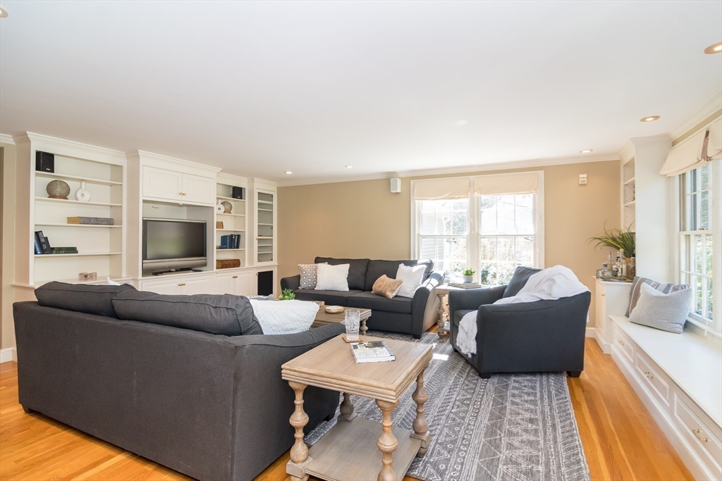 25 Edgewater Drive Needham, MA 02492 - Photo 7 of 25 a living room with furniture and a flat screen tv