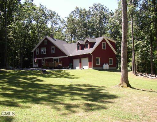 121 Pumpkin Hill Road New Milford, CT 06776 - Photo 1 of 1 a front view of a house with a yard