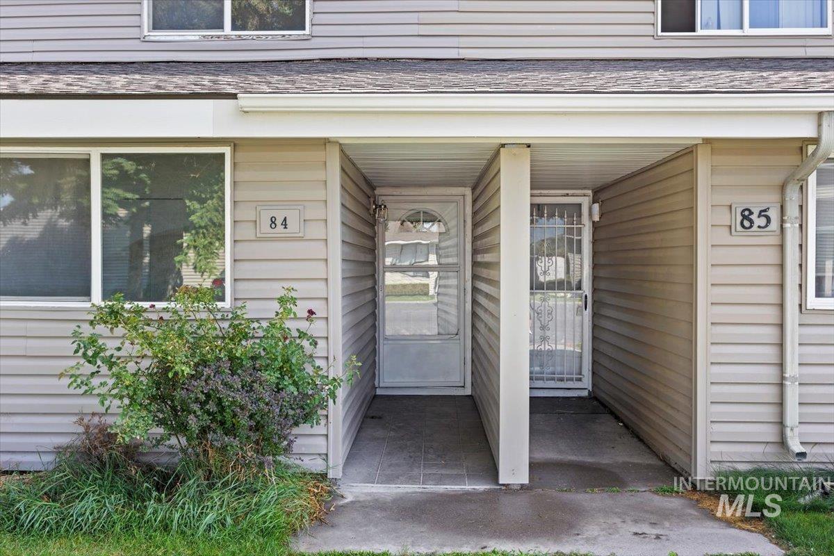 259 Pheasant Road, Unit 84 Twin Falls, ID 83301 - Photo 3 of 25 Exterior entrance featuring vinyl siding, an overhead soffit, and concrete porch