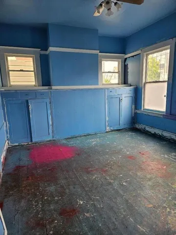 a room with window and gate