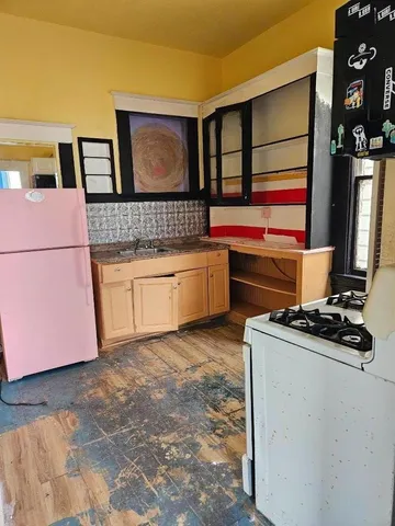 a kitchen with a stove and a microwave